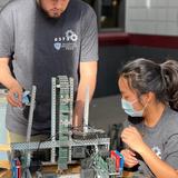 Madison Highland Prep Photo #6 - VEX Robotics team members adjusting their robot for competition!