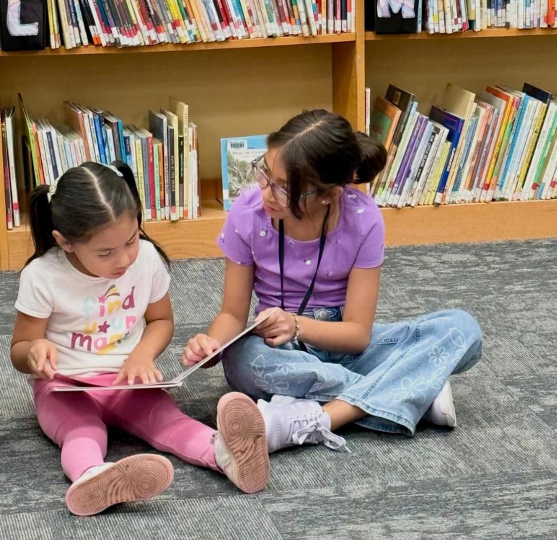 Harris Elementary School Photo #1 - Reading with our Buddies is the best! We love to see students from different grade levels creating friendships.