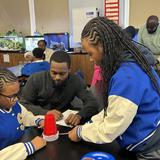 Stephen Decatur Magnet School of Leadership, Exploration, and the Arts Photo #5 - Students and Parents engage in a science experiment at M.S. 35's parent Meet & Greet.